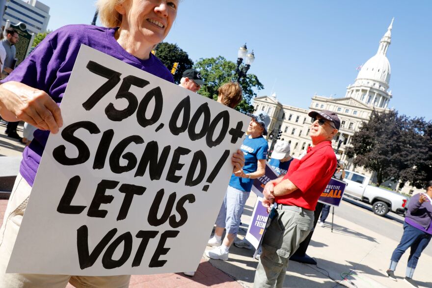 Abortion rights supporters gather outside the Michigan Capitol in Lansing, Mich., during a rally on September 7, 2022.