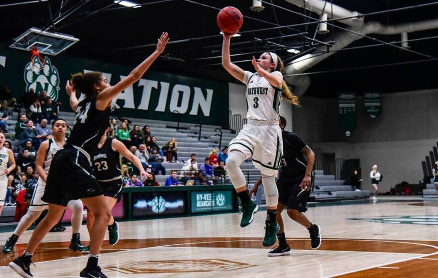 Action shot of Jaelyn Haggard vs Northeastern State basketball
