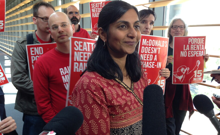 Seattle City Councilmember Kshama Sawant meets with reporters after the vote to phase-in a $15 minimum wage June 3, 2014.