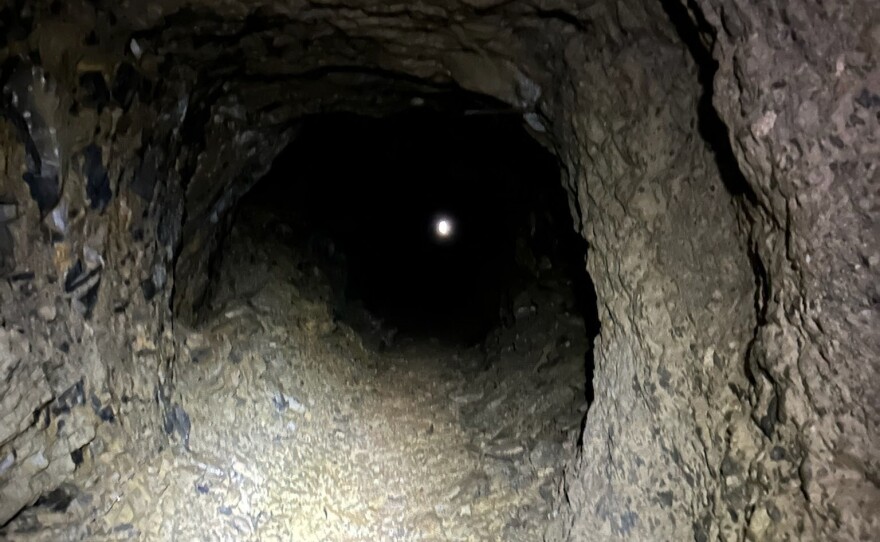 A speck of daylight from the entrance to a mine shaft in the Judith Mountains.