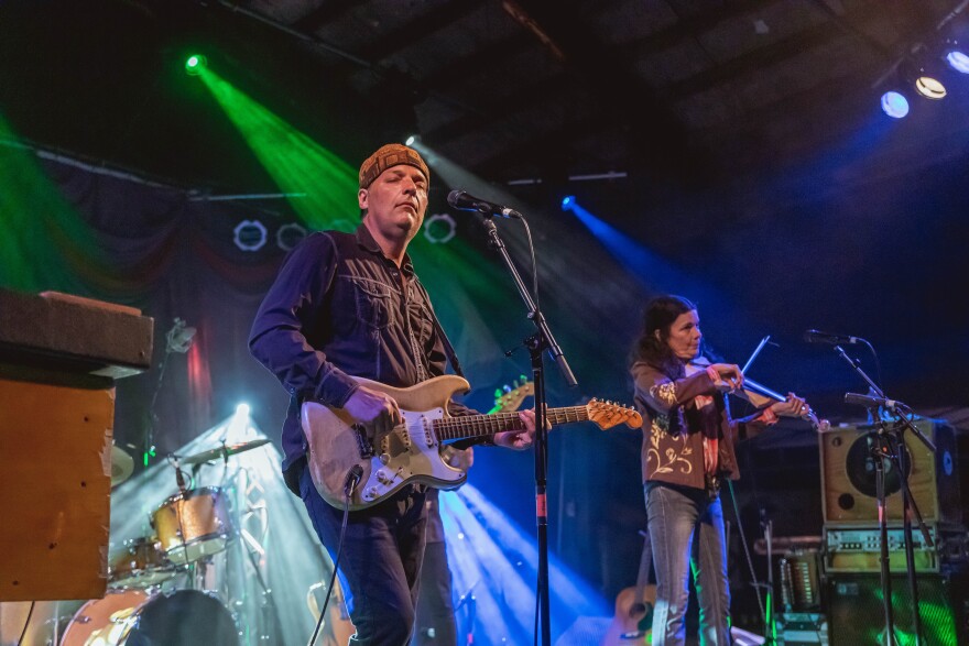 Jeb Puryear and Tara Nevins of Donna the Buffalo perform on the Grandstand Stage at GrassRoots Weekend in July 2021.