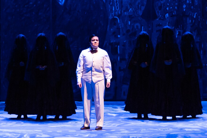 Mezzo-soprano Erin Leigh Koolman (García Lorca), and members of the chorus in IU Opera Theater's production of Ainadamar by Osvaldo Golijov