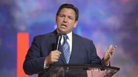 FILE - Florida's Republican Gov. Ron DeSantis addresses attendees during the Turning Point USA Student Action Summit on July 22, 2022, in Tampa, Fla. Newly released police bodycam footage shows that three of the 20 people who were arrested in Florida for allegedly voting illegally in the 2020 election appeared to be surprised that they had done anything wrong. The recordings, made by local police and obtained by the Tampa Bay Times, were published Tuesday, Oct. 18, 2022, after DeSantis announced charges against the suspects in August as the first major public move of his controversial election police unit. (AP Photo/Phelan M. Ebenhack, File)