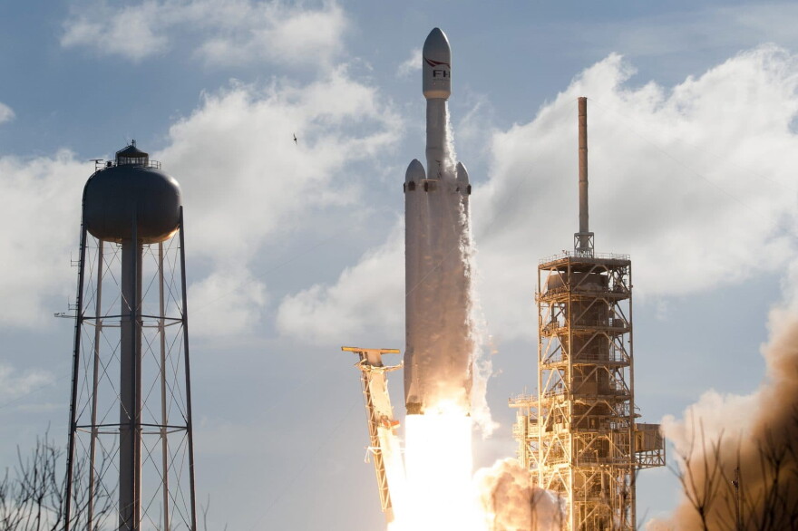 The SpaceX Falcon Heavy launches from Pad 39A at the Kennedy Space Center in Florida, on Feb. 6, 2018, on its demonstration mission.
The world's most powerful rocket blasted off Tuesday on its highly anticipated maiden test flight, carrying CEO Elon Musk's cherry red Tesla roadster to an orbit near Mars. (Jim Watson/AFP/Getty Images)