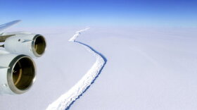 This Nov. 10, 2016 aerial photo released by NASA, shows a rift in the Antarctic Peninsula's Larsen C ice shelf. A vast iceberg with twice the volume of Lake Erie has broken off from a key floating ice shelf in Antarctica, scientists said Wednesday July 12, 2017 . The iceberg broke off from the Larsen C ice shelf, scientists at the University of Swansea in Britain said. The iceberg, which is likely to be named A68, is described as weighing 1 trillion tons (1.12 trillion U.S. tons).(John Sonntag/NASA via AP)