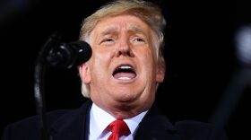US President Donald Trump speaks during a rally in support of Republican incumbent senators Kelly Loeffler and David Perdue ahead of Senate runoff in Dalton, Georgia.