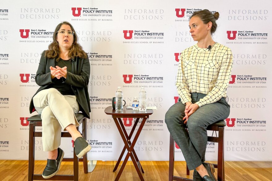 Beth Jarosz (left) and Mallory Bateman discuss recent data from the U.S. Census Bureau at a Kem C. Gardner Policy Institute Newsmaker Breakfast, June 27, 2023.