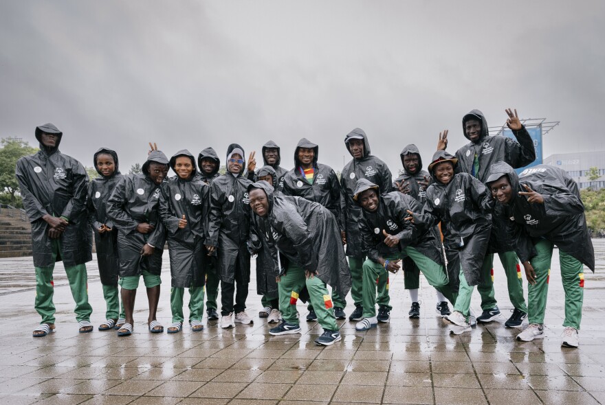 Ablaye Ndiaye (front row, center) poses with the Senegalese basketball team at the Special Olympics in Berlin. On Saturday, the team beat France to nail the bronze medal in 5-on-5 unified basketball. The coach says that Ndiaye, who has Down syndrome, brings energy and joy to the game and "is the face of the team."