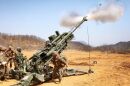 Marines with 1st Battalion, 12th Marine Regiment, fire the M777A2 155mm howitzer April 17 in support of a combined arms live-fire exercise at Rodriguez Live-Fire Complex during Korean Marine Exchange Program 13-5. U.S. Marine Corps