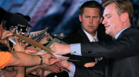 Film director Christopher Nolan signs autographs for fans during the <em>Inception</em> Japan Premiere at Roppongi Hills in Tokyo.