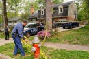 A police officer puts cordon tape on a hydrant outside the home of former Virginia Lieutenant Governor Justin Fairfax, after he shot and killed his wife Cerina Fairfax and himself, according to police, in Annandale, Virginia, U.S, April 16, 2026. REUTERS/Nathan Howard
