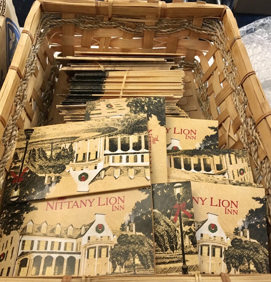 A basket full of old fashioned Nittany Lion Inn cards.