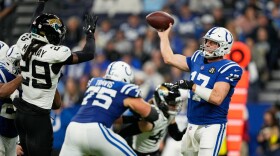Indianapolis Colts quarterback Philip Rivers (17) throws under pressure from Jacksonville Jaguars safety Eric Murray (29) during the second half of an NFL football game Sunday, Dec. 28, 2025, in Indianapolis.