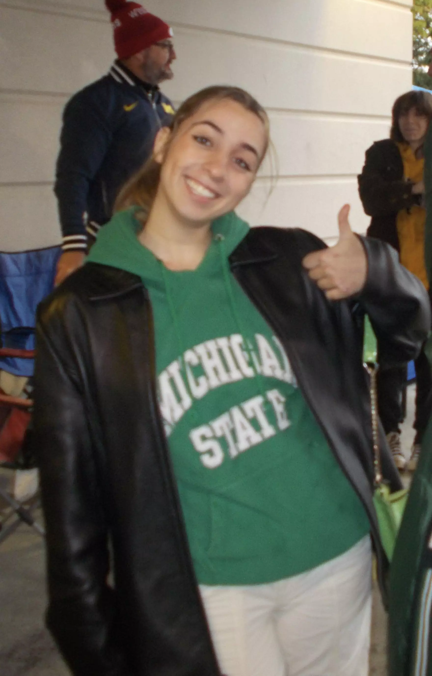 Saba Saed, a Michigan State University student, poses in a MSU sweatshirt. Saed said she feels her Palestinian heritage is often viewed as a threat on campus.