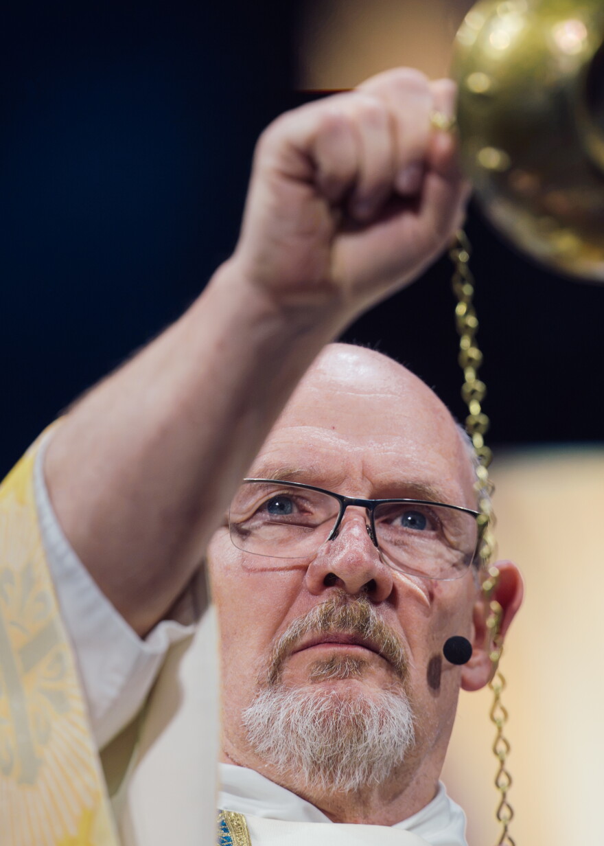 A clergy swings a thurible during the beatification Mass for the late Archbishop Fulton J. Sheen on Thursday at the Dome at America's Center.