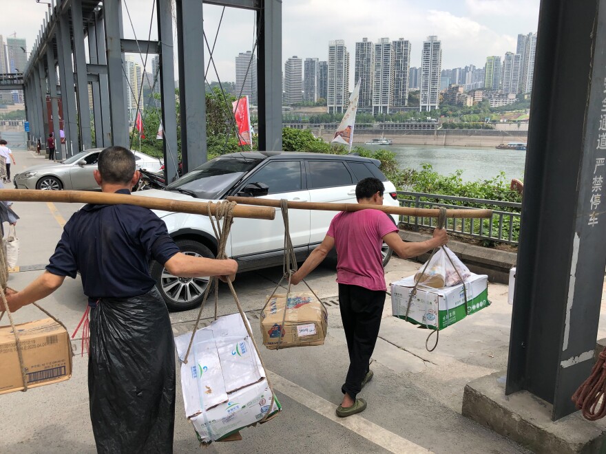 Many of Chongqing's street porters known as "bangbang" — which means "stick-stick" men — were displaced amid the city's large-scale development.
