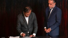  Colombian President Gustavo Petro (left) signing a decree appointing Armando Benedetti (right) as Colombia's new ambassador to Venezuela.