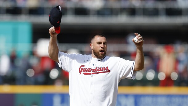 Kansas City Chiefs tight end Travis Kelce prepares to throw out the ceremonial first pitch before a baseball game between the Cleveland Guardians and the Seattle Mariners, Friday, April 7, 2023, in Cleveland.