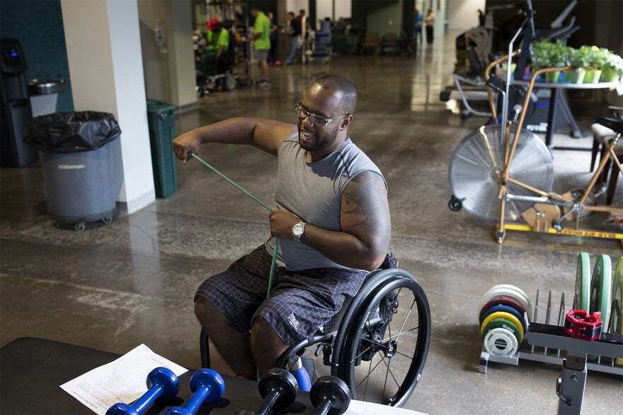 Aaron Murray completes a workout at Paraquad in St. Louis. Physical therapy and weight training has helped him regain his strength after his injury. 