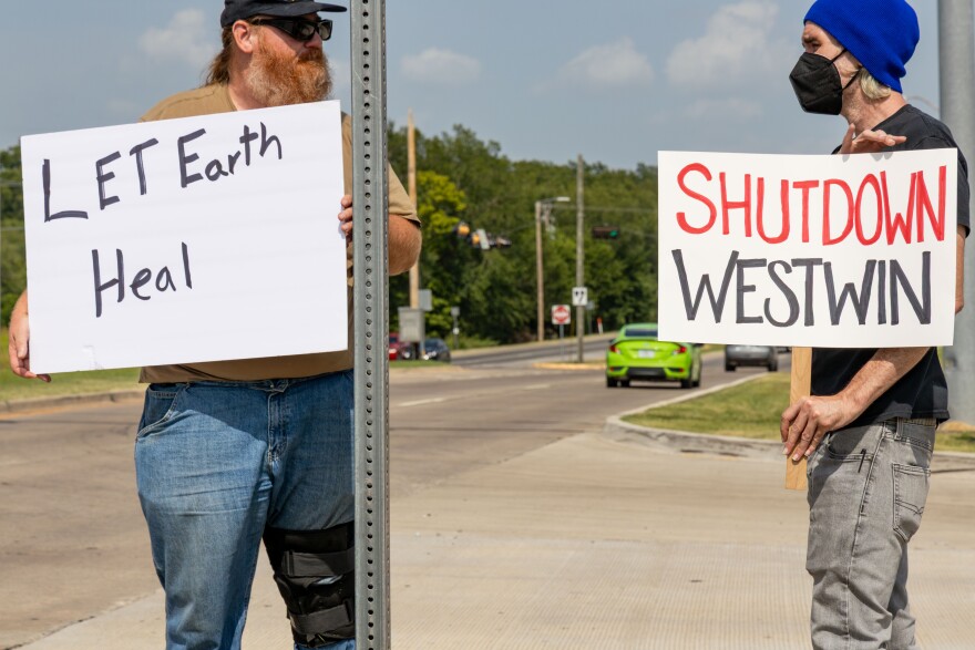 Protestors gather at a busy intersection in the southwest Oklahoma city of Lawton on July 17, 2025. They are united in their fight against a nickel refinery in town called Westwin Elements.