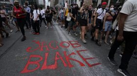Demonstrators march through the city during a protest in New York  against the shooting of Jacob Blake who shot in the back multiple times by police in Kenosha, Wisconsin, on Sunday, prompting community protests. 