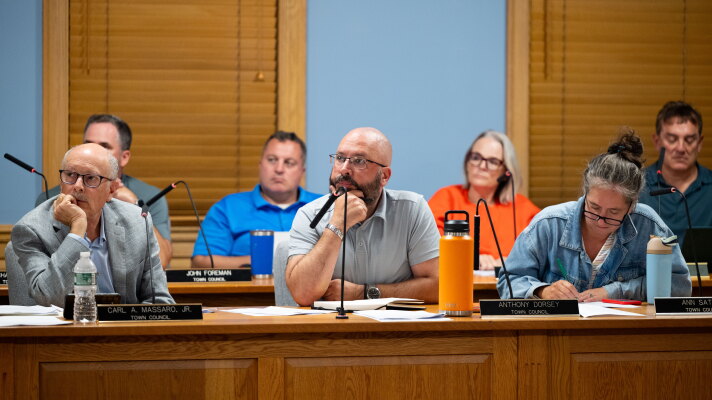 (L-R) Town Council members Carl Massaro, Anthony Dorsey, and Ann Sather listen as local residents give their testimonies on how they feel about the pre-existing data center moderinzing into an AI Data center at Trumbull town hall on September 9, 2026 in Trumbull, Connecticut.