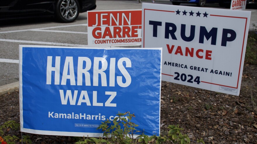 Political signs outside the early voting site at Santa Fe College Northwest campus. (Aimee Sullivan/WUFT.