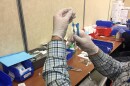 A medical provider preparing a COVID-19 vaccine