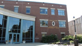 a wide shot of the exterior of the red brick Boone County government building