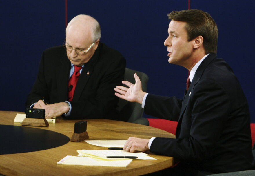 Vice President Dick Cheney takes notes as Democratic vice presidential candidate Sen. John Edwards speaks during their vice presidential debate at Case Western Reserve University in Cleveland  on Tuesday, Oct. 5, 2004. (Rick Wilking/AP)