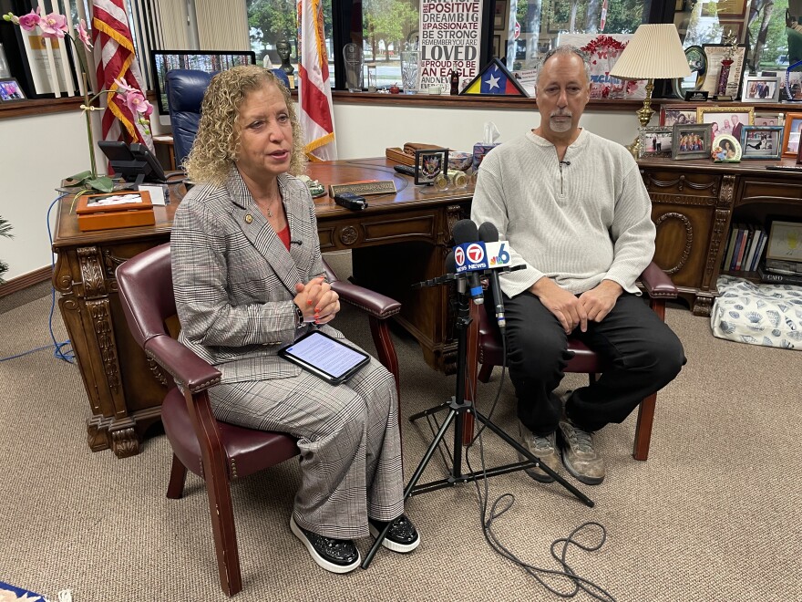Congresswoman Debbie Wasserman Schultz talks to the media with small business owner Steve Reyes. Reyes will accompany Wasserman Schultz to the State of the Union Address in Washington, D.C.