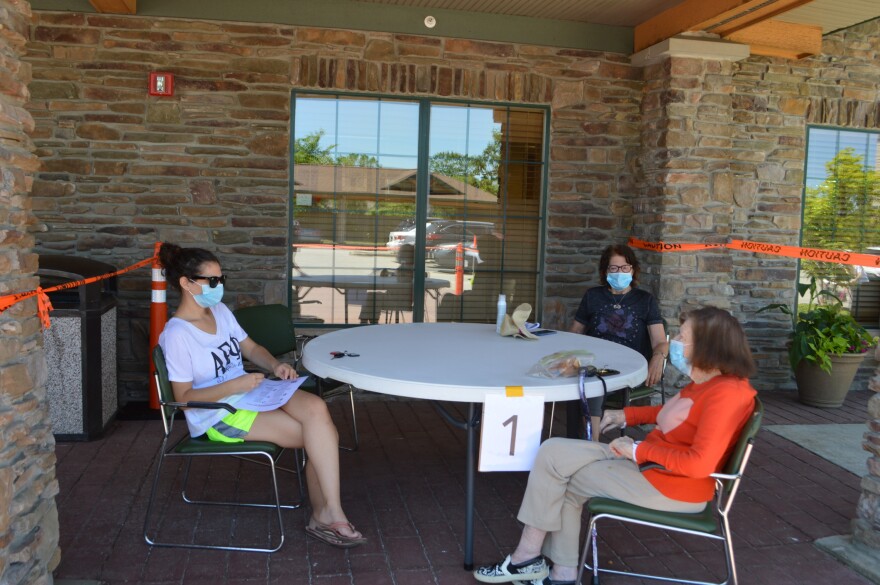 Menorah Park assisted living resident Lita Mintz (right) chats with her granddaughter Cary Broday (left) and daughter Enid Gurney on June 8, the first day long-term facilities were open to visitors in Ohio after nearly three months of being closed due to COVID-19. [Menorah Park]