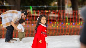 File photo of kids playing in artificial snow at San Antonio River Authority event