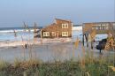 A house on East Corbina Drive in Rodanthe collapses into the Atlantic Ocean on Friday, Aug. 16, 2024.