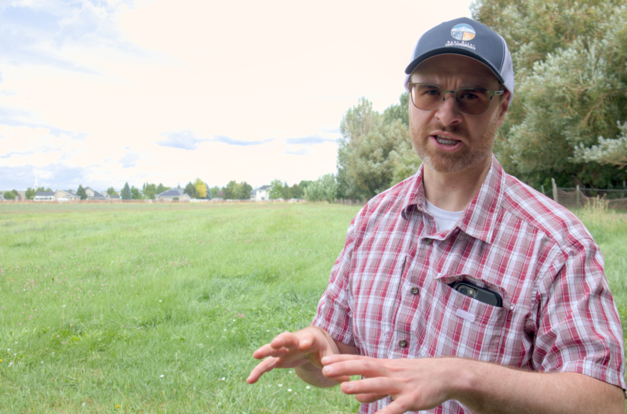 Gabriel Murray, the executive director of the nonprofit Bear River Land Conservancy, stands on Sheri Schiess' land in Nibley. With help from the nonprofit, Schiess entered into a conservation agreement that will prevent over 25 acres of her farm from ever being developed.