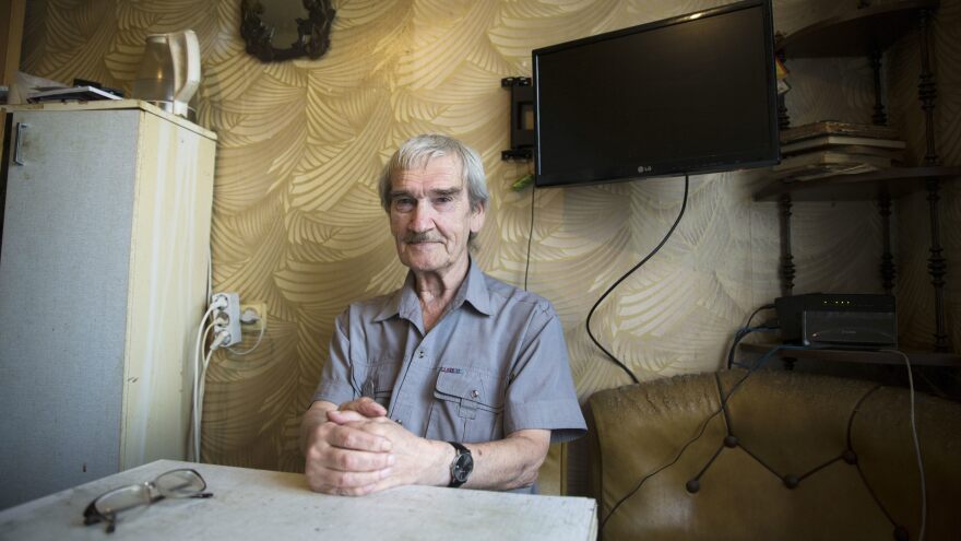 Stanislav Petrov, a former Soviet military officer, poses at his home in 2015 near Moscow. In 1983, he was on duty when the Soviet Union's early warning satellite indicated the U.S. had fired nuclear weapons at his country. He suspected, correctly, it was a false alarm and did not immediately send the report up the chain of command. Petrov died at age 77.