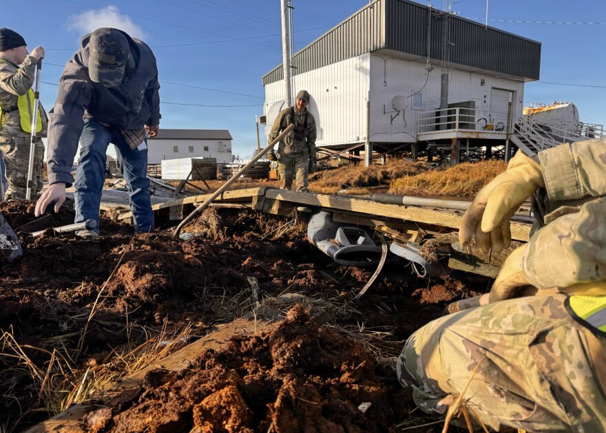 Alaska Organized Militia members, assigned to Task Force Bethel, clean up debris at Kwigillingok, Alaska, during post-storm recovery efforts for Operation Halong Response, Oct. 20, 2025. AKOM members, including Alaska Air and Army National Guardsmen and members of the Alaska Naval Militia and Alaska State Defense Force, continue coordinated response operations in support of the State Emergency Operations Center following Typhoon Halong.