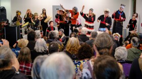 Alutiiq Dancers drew a crowd that filled the new event space at the Alutiiq Museum, with some standing in the doorways for a glimpse of the dancers during the museum's reopening in 2025.