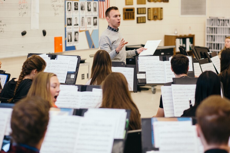 Band teacher Brian Lukkasson leads a discussion with his class about the perspectives of the composers they play, focusing on composers of color in the civil rights era.