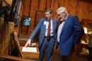 Former Gov. Eric Holcomb, right, and Charles Hyde, president and CEO of the Benjamin Harrison Presidential Site, left, on Thursday, March 19, 2026, at the opening of the new “Presidential Ink” exhibit in Indianapolis.