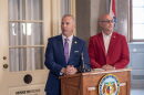 State Sen. Rick Brattin, a Republican from Harrisonville, and Secretary of State Denny Hoskins speak to reporters outside Hoskins's office in the Missouri State Capitol Tuesday. The press conference also drew in LGBTQ+ advocates who criticized the two officials for attacks on a "rainbow story time" held in Columbia Saturday.
