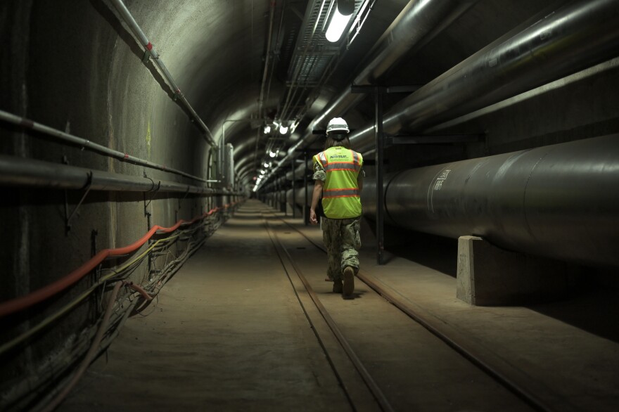 (July 17, 2020) Fuels director, LCDR Shannon Bencs walks a portion of the 7 miles of tunnels of the Red Hill Underground Fuel Storage Facility. (U.S. Navy photo by Daniel Mayberry/Released)