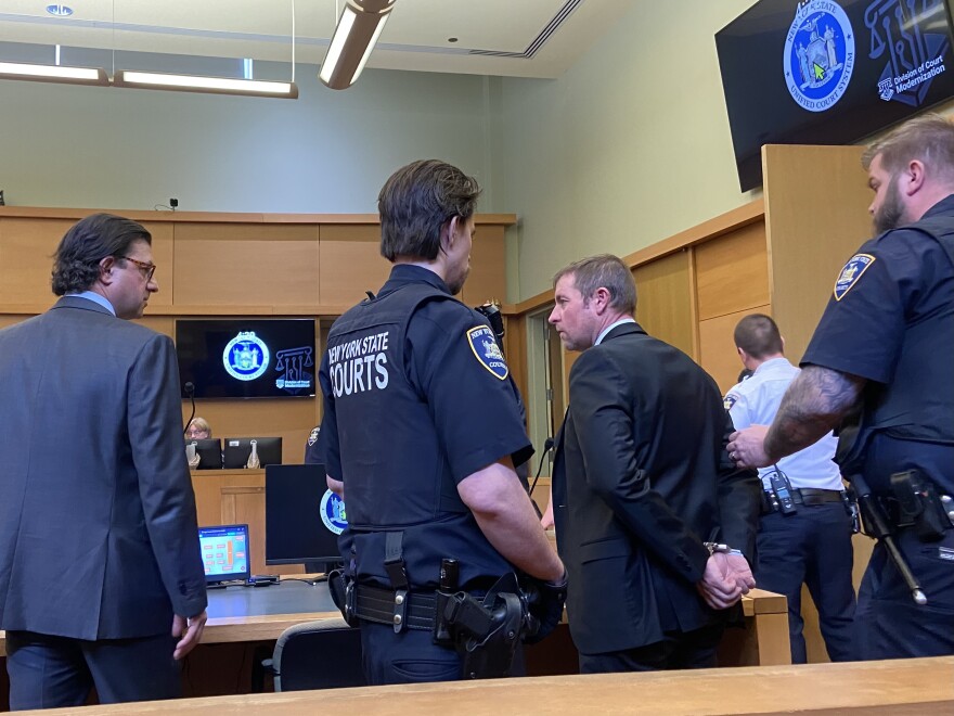 John Reilly in handcuffs after verdict 3-26-26