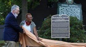 Concord Mayor Byron Champlin (L) and Black Heritage Trail of New Hampshire Executive Director JerriAnne Boggis unveil a marker honoring William Penn Thompson, a black baseball player, in Concord on Aug. 12, 2026.