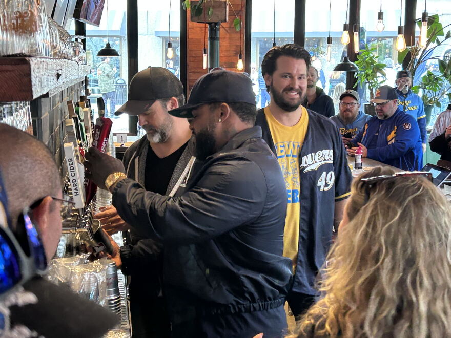 Former Brewers player Prince Fielder pours beers for fans at Draft & Co Friday morning.