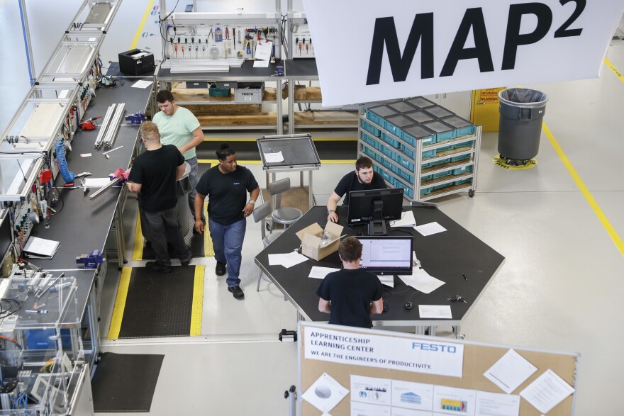 Apprentices stand at workstations at the automation learning center at the Festo distribution facility, Wednesday, May 17, 2017 in Mason, Ohio.