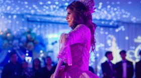 Citlaly Olvera Salazar dances with an image of her grandfather, Antonio Salazar, and father, Cesar Olvera, in their absence during her Quinceañera.
