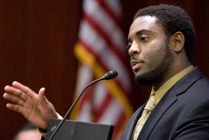 In this Nov. 5, 2009 file photo, Reginald Dwayne Betts, writing workshop program director, speaks during a school forum on Capitol Hill in Washington, D.C. Betts, a convicted felon who graduated from Yale Law School and won acclaim as a poet, was admitted to the state bar Friday, Sept. 29, 2017, by the Connecticut Bar Examining Committee.