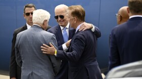 US President Joe Biden meets John Larson (L-R) and Connecticut Governor Ned Lamont after Biden arrived at Bradley Airport to attend the National Safer Communities Summit at University of Hartford. (Tyler Russell/Connecticut Public).