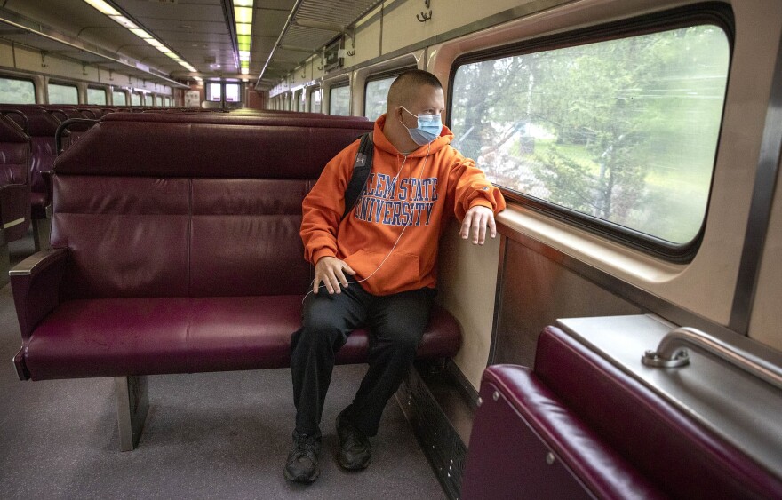 Matthew Cullen rides the MBTA Commuter Rail from Ipswich to Newburyport. (Robin Lubbock/WBUR)